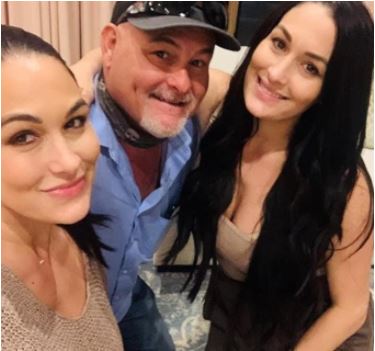Jon Garcia with his daughter Nikki and Brie Bella